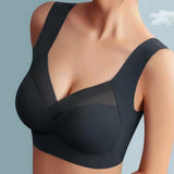 Reggiseno sportivo nero senza cuciture, design a V, spalline larghe, comfort e supporto, ideale per attività fisica e quotidiana.