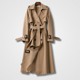 Cappotto trench beige elegante, doppio petto, cintura in vita, bottoni neri, design classico, moda autunnale, abbigliamento donna.