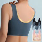 Donna di spalle indossa reggiseno sportivo senza cuciture blu. Set di reggiseni in vari colori mostrati a lato. Comfort, moda, intimo femminile.
