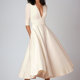Abito elegante avorio a maniche tre quarti, scollo a V profondo, gonna svasata. Moda donna, abbigliamento formale, stile sofisticato.